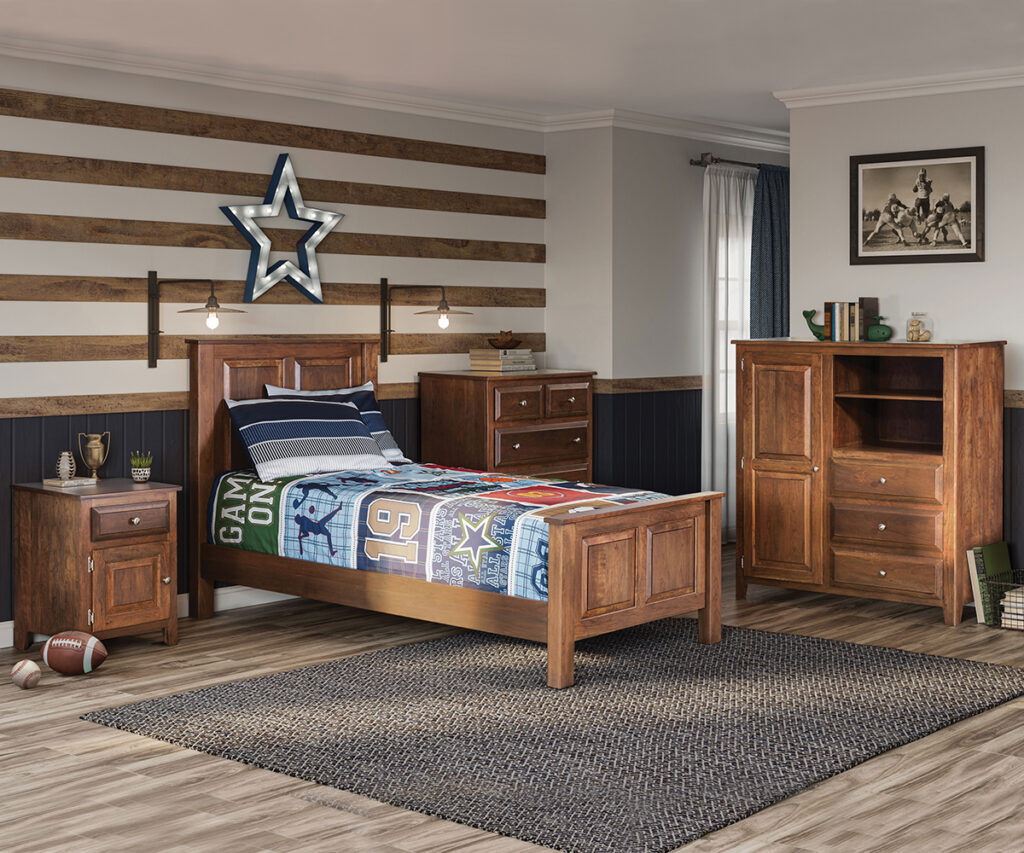 Children’s furniture set with wood bed, dresser, chest, and nightstand in a sporty bedroom.
