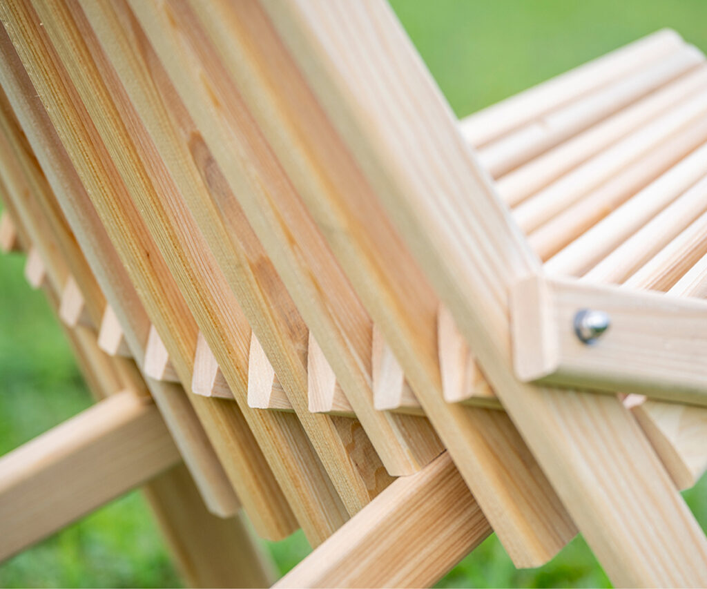 Poly vs. Wood Outdoor Furniture: Which Should You Choose? 5 Close-up of natural wood outdoor chair slats and frame details